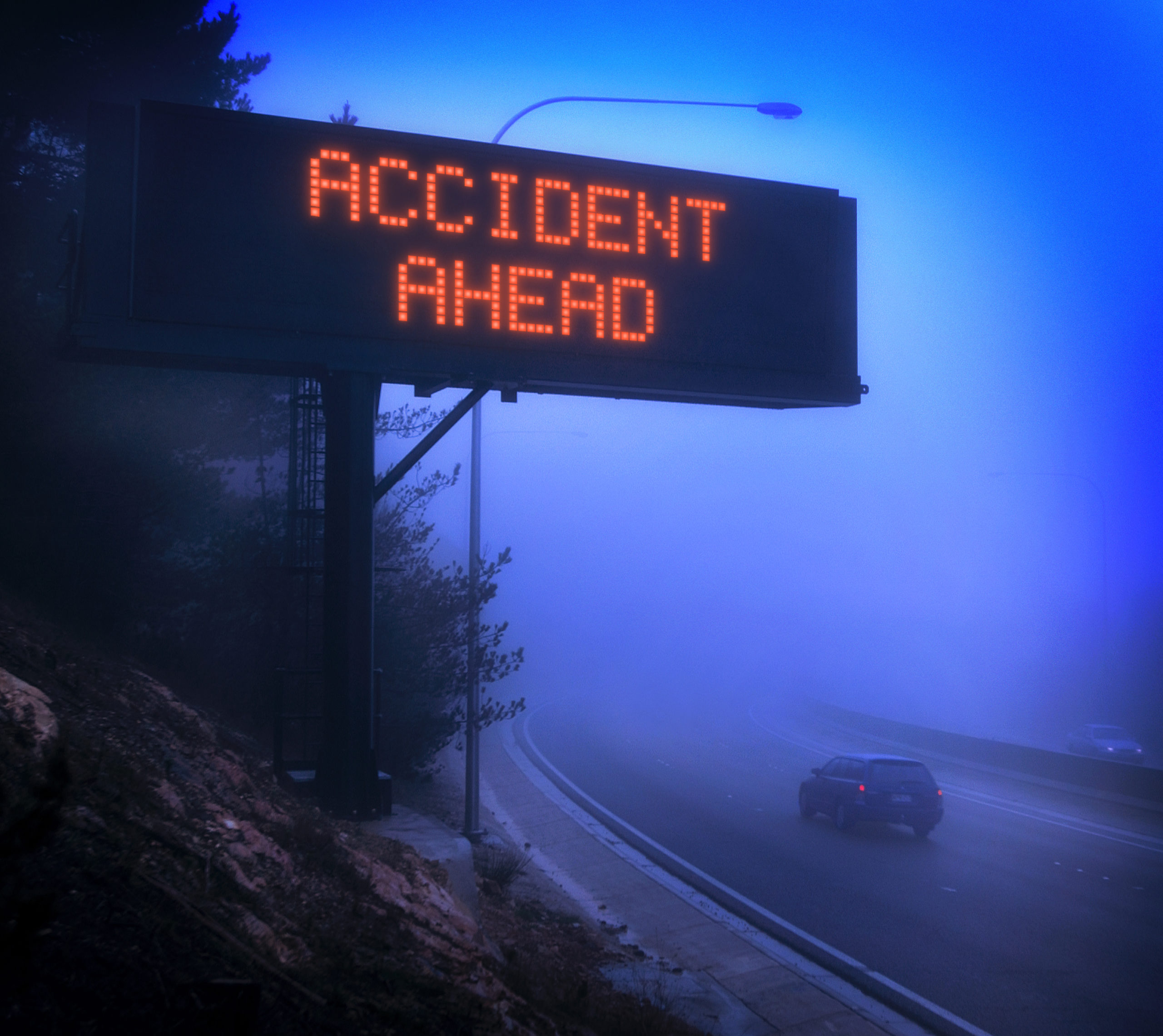 The Most Common Injuries Following a Car Crash - accident road alert system over mountain highway at night