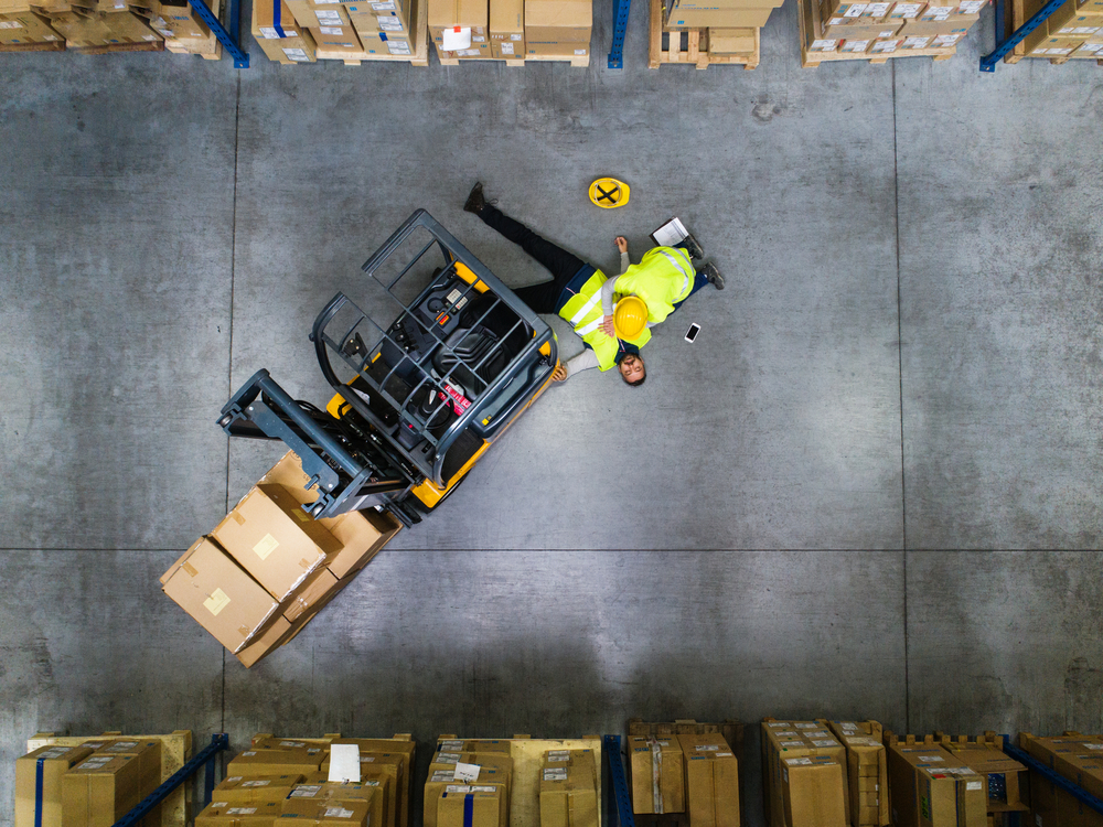 Examples Of Retaliation After Filing Workers' Comp - Warehouse workers after an accident in a warehouse.